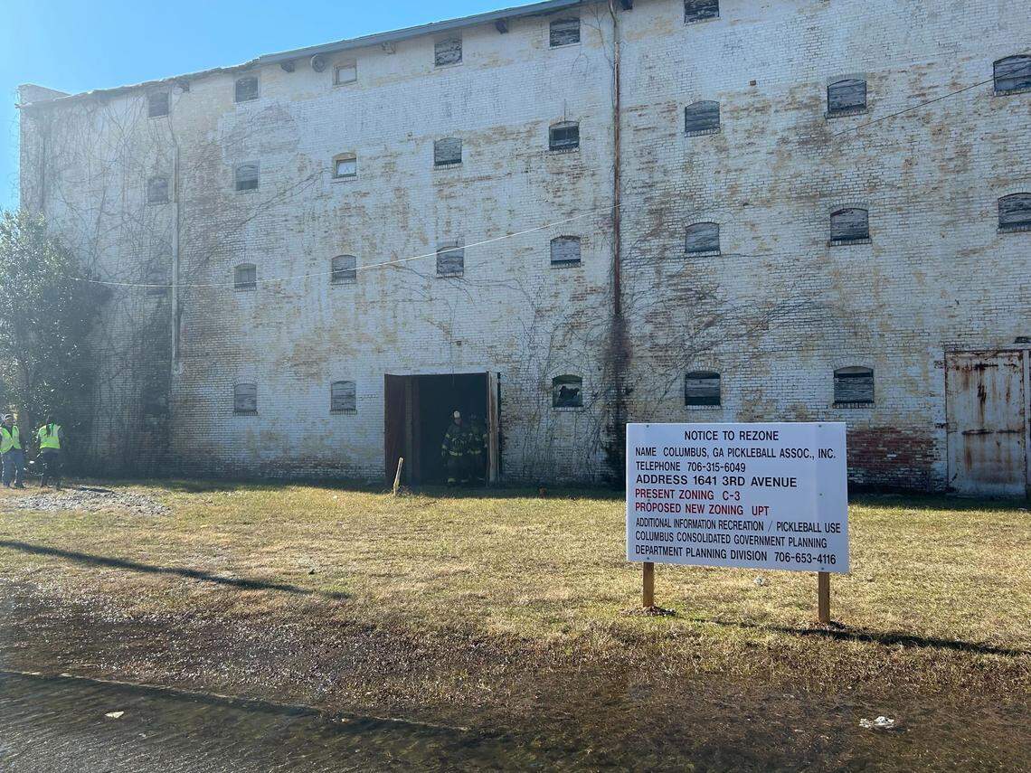 The Columbus fire department responded to a fire at an old warehouse which is expected to be turned into a pickleball facility, with a sign outside showing the rezone intent.