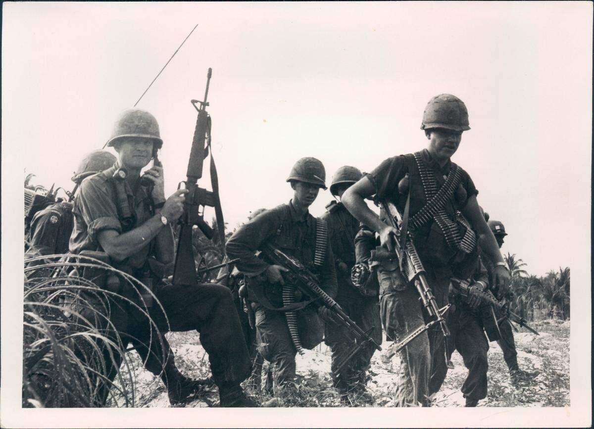 Brigade Commander Hal Moore, left, leads his troops in Vietnam in early 1966.