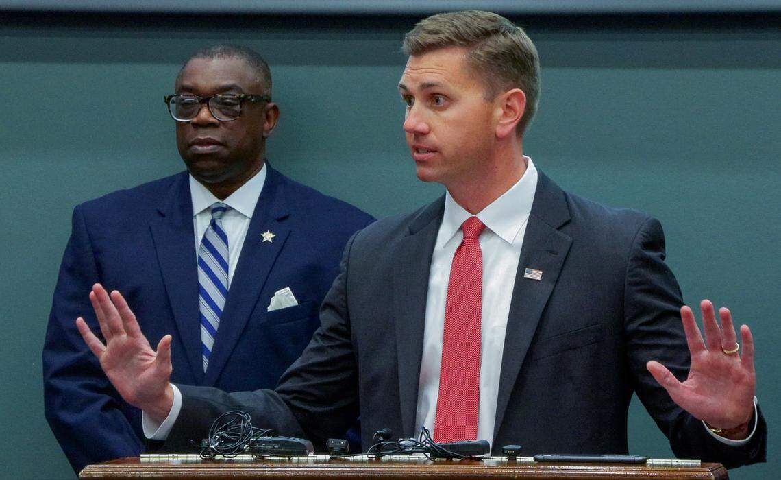 William Keyes, U.S. attorney for the Middle District of Georgia, front, speaks during an April 20, 2026, news conference at the Muscogee County Sheriff’s Office in Columbus about the results of Operation Sweet Silence.