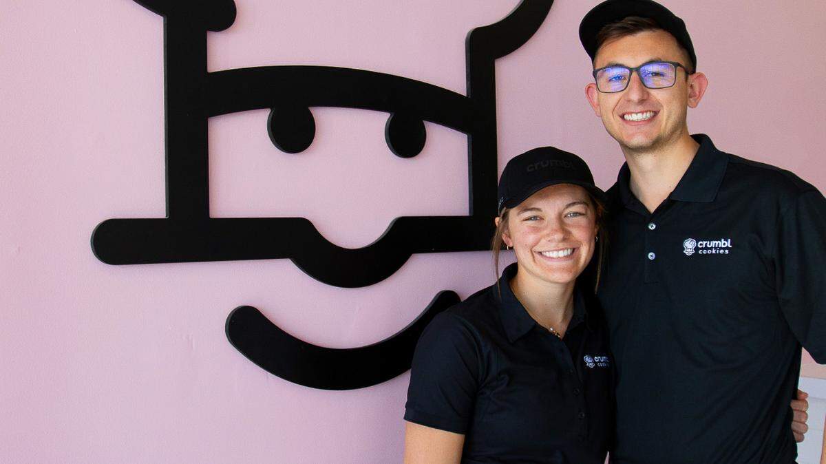 From left, Macy Murphy, owner/director of catering, and Chase Murphy, owner/director of operations, are bringing Crumbl Cookies to Columbus.