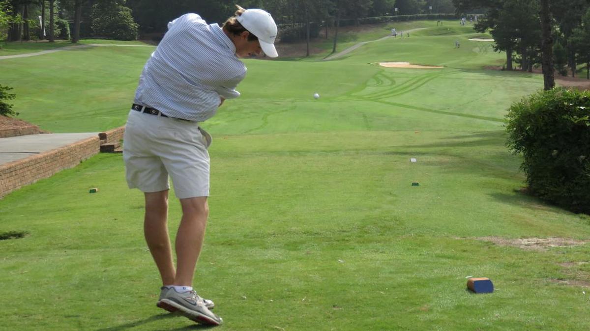 Brookstone’s Frank Waldrep hits his tee shot on the first hole at Green Island Country Club in the opening round of the Class 1A Private boys state golf tournament on Monday.