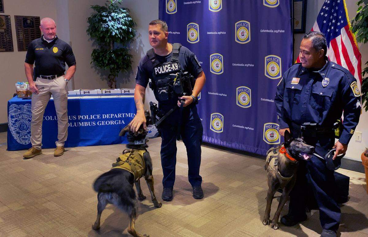 The Columbus Police Department swore in its newest four-legged officers Monday in what CPD calls the largest K-9 unit the department has had. Pictured are two of the four. The dogs are Havoc (2-year-old German Shepherd), Colt (2-year-old Belgian Malinois), Nevtiri (8-year-old Belgian Malinois) and Redd (8-year-old Dutch Shepherd). 08/25/2025