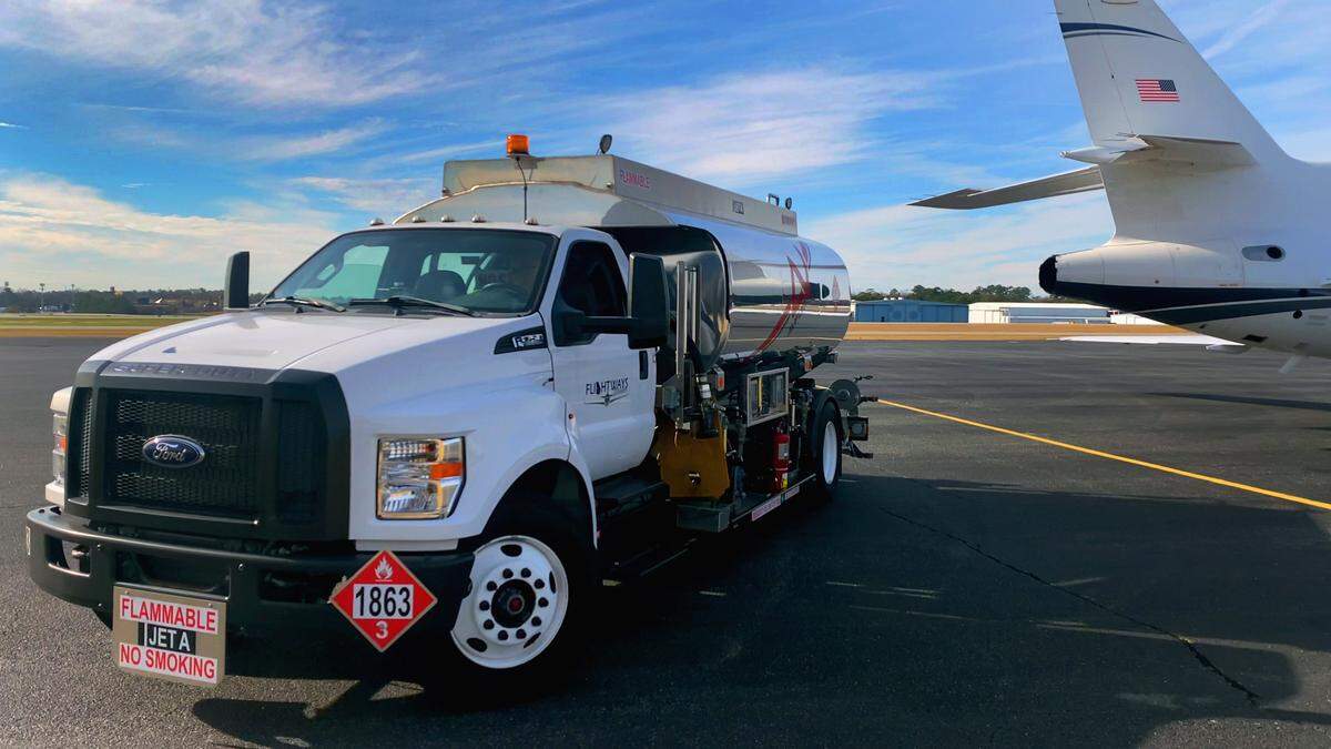 A fuel truck pulls away after refueling a jet that arrived at the general aviation terminal at the Columbus Airport on Jan. 15, 2025