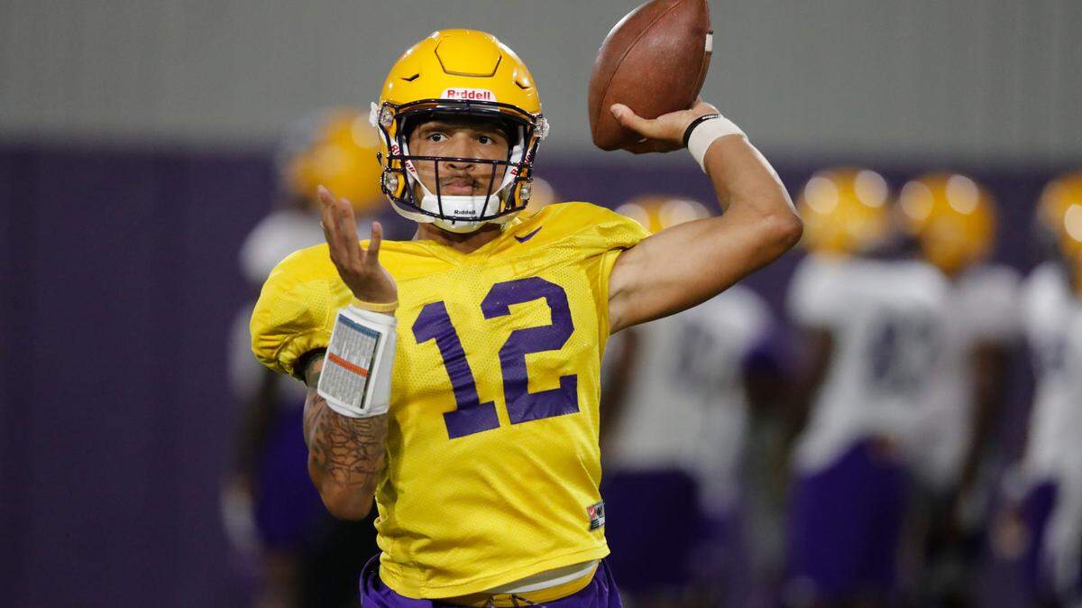 LSU quarterback Justin McMillan (12) passes during their NCAA college football practice in Baton Rouge, La., Monday, Aug. 6, 2018
