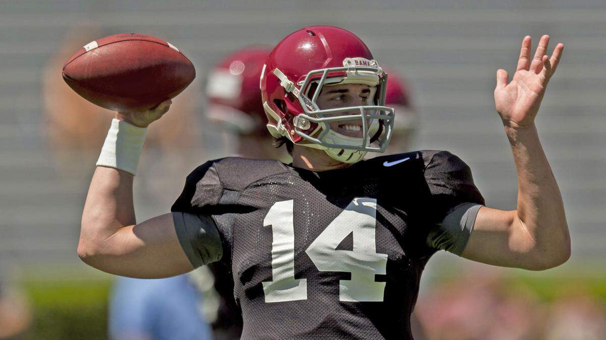 VASHA HUNT/AL.com via APAlabama quarterback Jacob Coker (14) works through passing drills during Alabama spring football practice April 11 at Bryant-Denny Stadium in Tuscaloosa, Ala. Coker missed both of the Tide's Monday practice, but was back out there on Tuesday in a limited capacity.