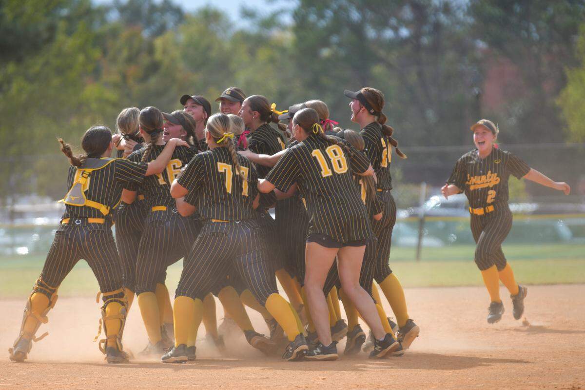 The Harris County High School softball team celebrates winning the Georgia High School Association Class AAAA state championship Nov. 2, 2024, at South Commons in Columbus.