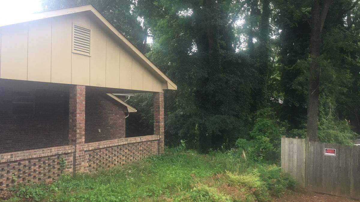 A Columbus woman said this vacant property in the 600 block of Southern Pines Drive is the source of snakes and wood rats crawling onto her property.