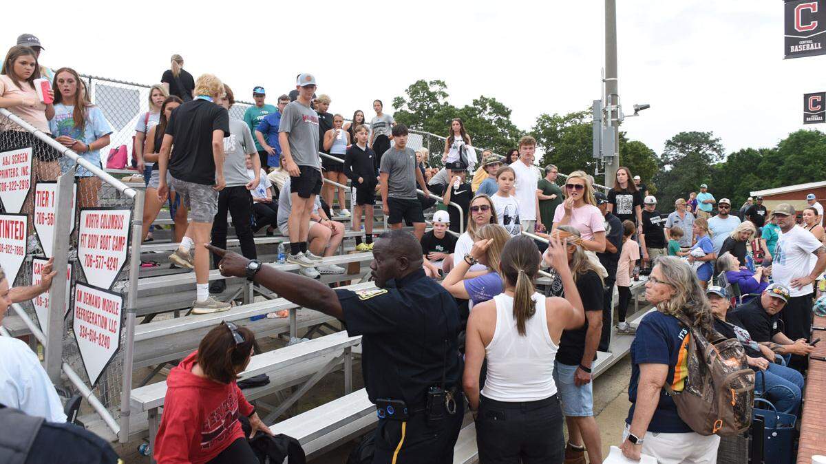 A Phenix City police officer responds to a disturbance in the stands at the Central High School baseball game against Smiths Station High School at Darnell-Nelson Field on April 18, 2024.