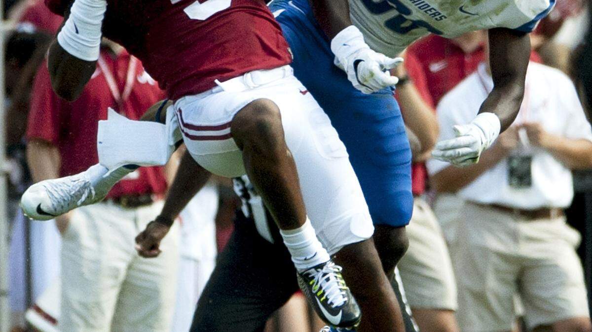 MICKEY WELSH/The Montgomery Advertiser/Associated PressAlabama defensive back Cyrus Jones intercepts a pass intended for Middle Tennessee's Ed Batties during the first half Saturday in Tuscaloosa, Ala.