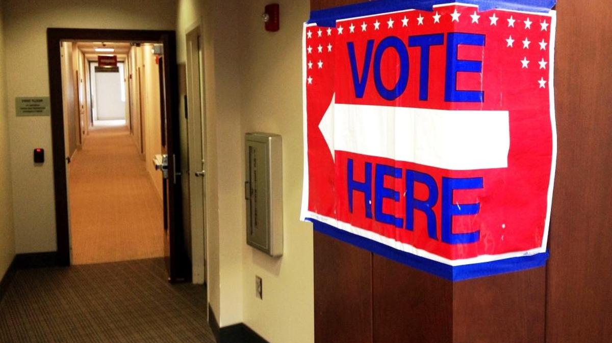 In this 2016 photo, a sign points to the voting area at the Columbus Citizens Service Center in the community room down a hall off the main lobby.