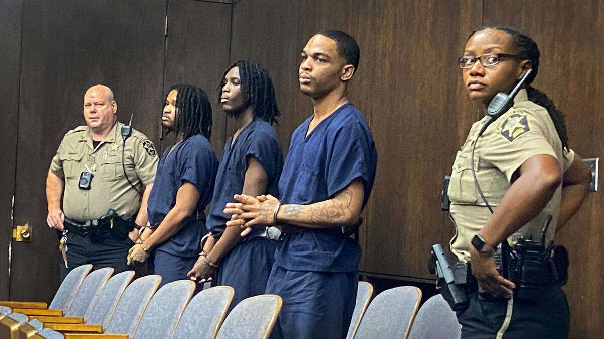 From L-R in center, defendants Vic’trez Jaequan Thomas, Jyquarious Varner and Cecil Brian Berguin III wait for a plea hearing to begin Thursday morning in before Superior Court Judge John Martin in Columbus.