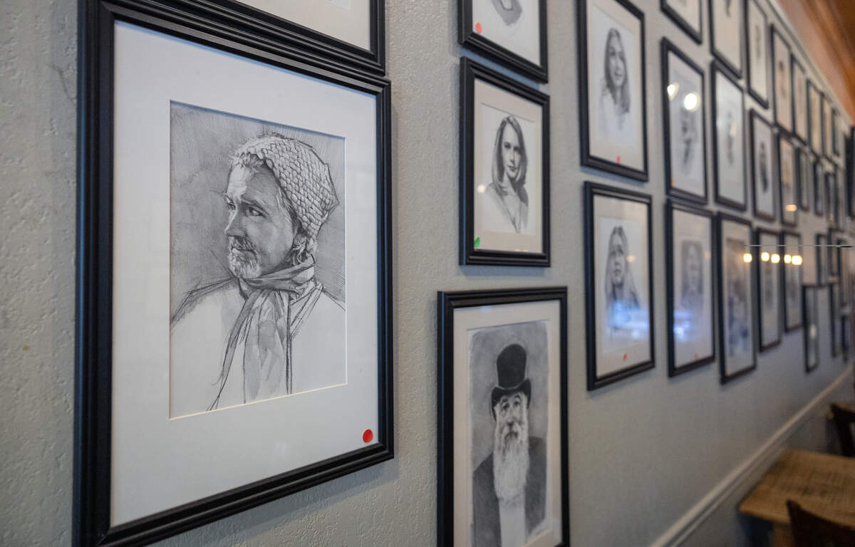 These are some of the more than 90 portraits drawn by Columbus artist Garry Pound and hung on the walls of Fountain City Coffee in Columbus, pictured June 25, 2026.