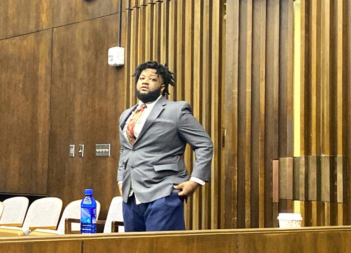 Emmanuel Truitt returns to the courtroom after a break in his Columbus murder trial.