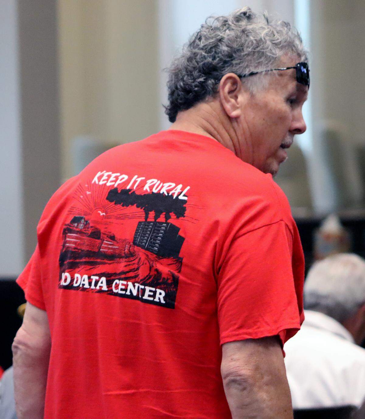 A Columbus resident wears a “Keep It Rural, No Data Center” shirt at the June 2, 2026, city council meeting in opposition to the proposed Project Ruby hyperscale data center and the proposed technology overlay ordinance.