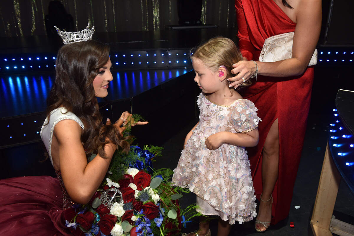 2026 Miss Georgia Sophia Wootten greets a fan backstage at the Miss Georgia the 2026 Miss Georgia Scholarship Saturday evening at the Columbus RiverCenter.