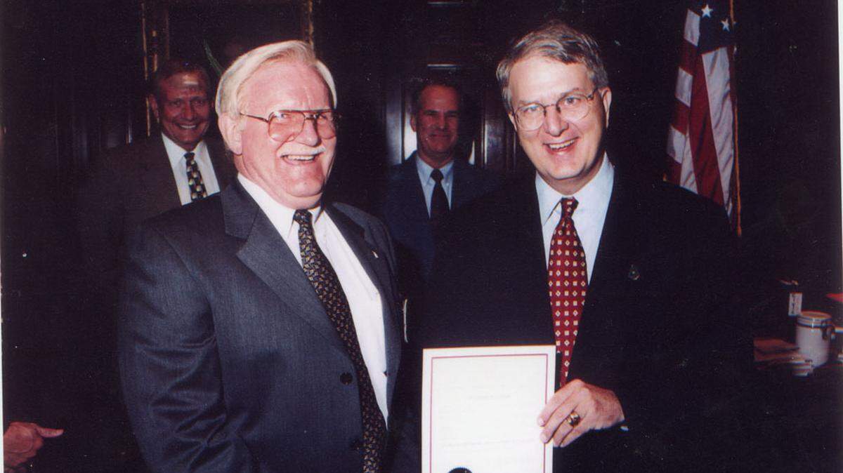 In this undated photo, Archie Rainey, left, director of Command College at Columbus State University, is honored by then-Gov. Roy Barnes.