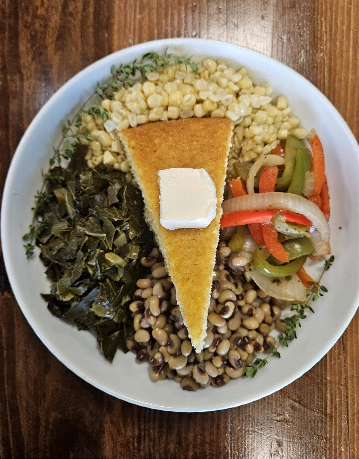 The main dish for The Food Mill’s restaurant week lunch comes with pink-eye peas, collards, silver queen corn, sauteed peppers, cornbread, and vegan butter. A drink and dessert are also part of the special.