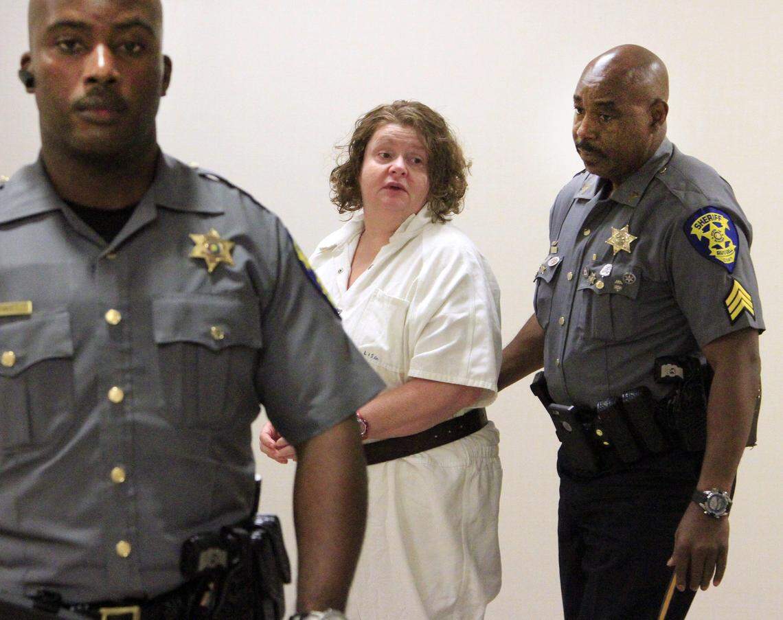 Mike Haskey mhaskey@ledger-enquirer.comRussell County Sheriff's Office deputies escort Lisa Leanne Graham into court Thursday afternoon. Circuit Judge Jacob Walker III delayed the sentencing of Graham so she can undergo a mental evaluation. 05/28/15