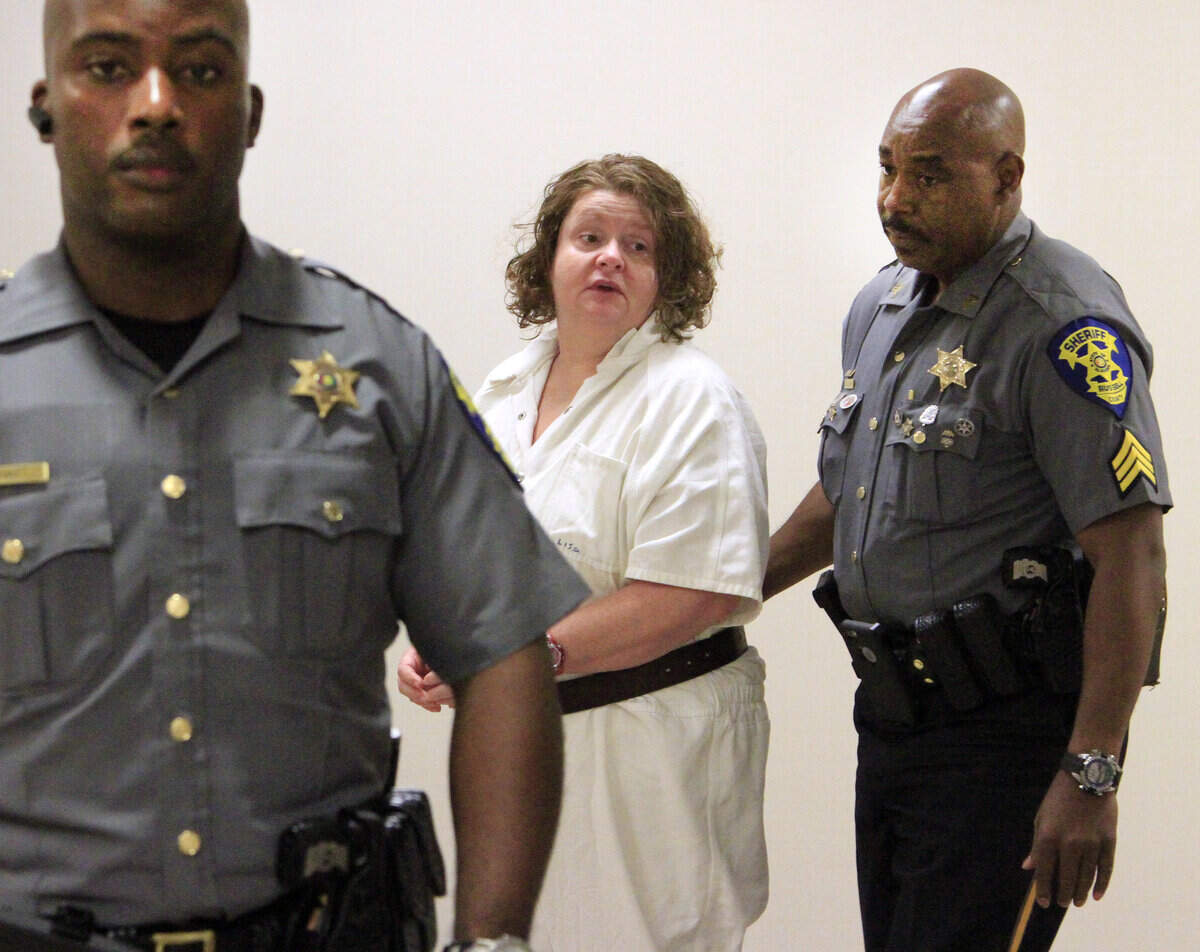 Mike Haskey mhaskey@ledger-enquirer.comRussell County Sheriff's Office deputies escort Lisa Leanne Graham into court Thursday afternoon. Circuit Judge Jacob Walker III delayed the sentencing of Graham so she can undergo a mental evaluation. 05/28/15