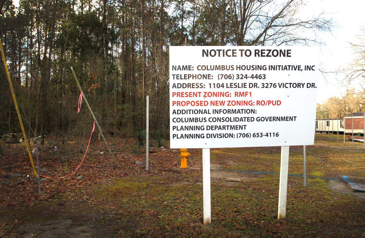 A “Notice to Rezone” sign has been placed at the corner of Leslie Drive and Plateau Drive in Columbus, Georgia concerning a new development. 01/19/2022