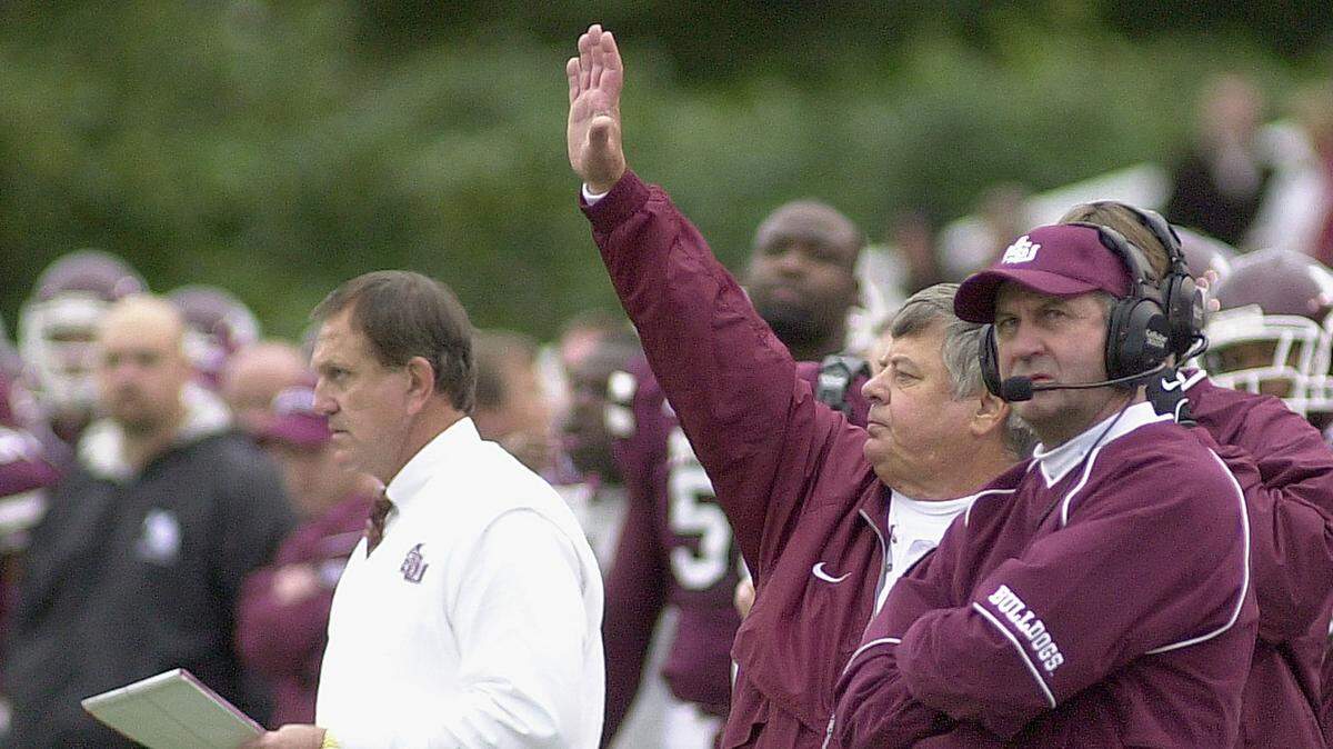 Mississippi State football coaches Jackie Sherrill, left, Joe Lee Dunn, center, and Curley Hallman, right, direct the Mississippi State defense during the first quarter against Kentucky, Saturday, Nov. 2, 2002, in Starkville, Miss. Kentucky won 45-24.