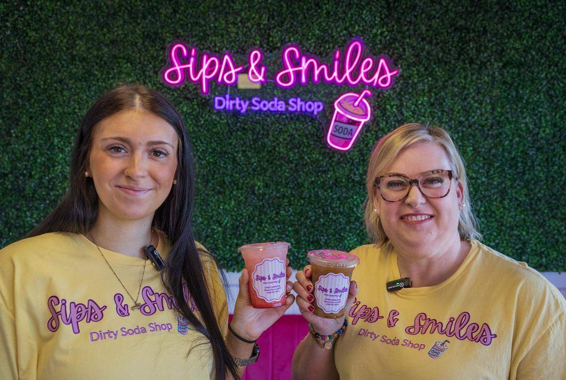 Cidney Mitchell, left, and Chrissy Pillman, pictured April 13, 2026, have opened Sips & Smiles, a “dirty soda” shop, at 3738 Opelika Road in Phenix City.