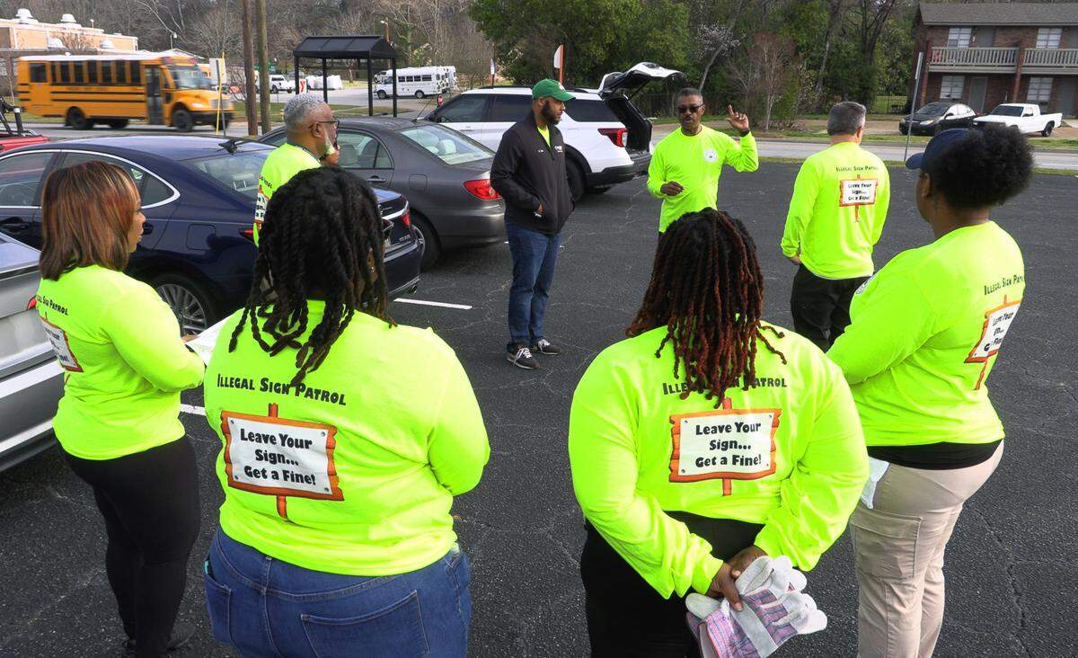 Columbus city manager Isaiah Hugley speaks with city employees Thursday morning before they began removing illegally placed signs on the city right-of-way as part of the first “Operation Illegal Sign Roundup Campaign.” 02/27/2025
