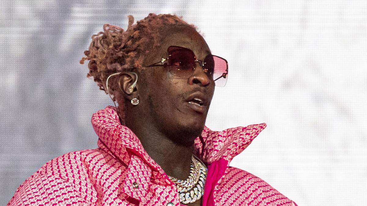 In this file photo, Young Thug performs at the Lollapalooza Music Festival in Chicago on Aug. 1, 2021. A racketeering and gang case against the rapper and others is underway in Atlanta. (Photo by Amy Harris/Invision/AP, File)