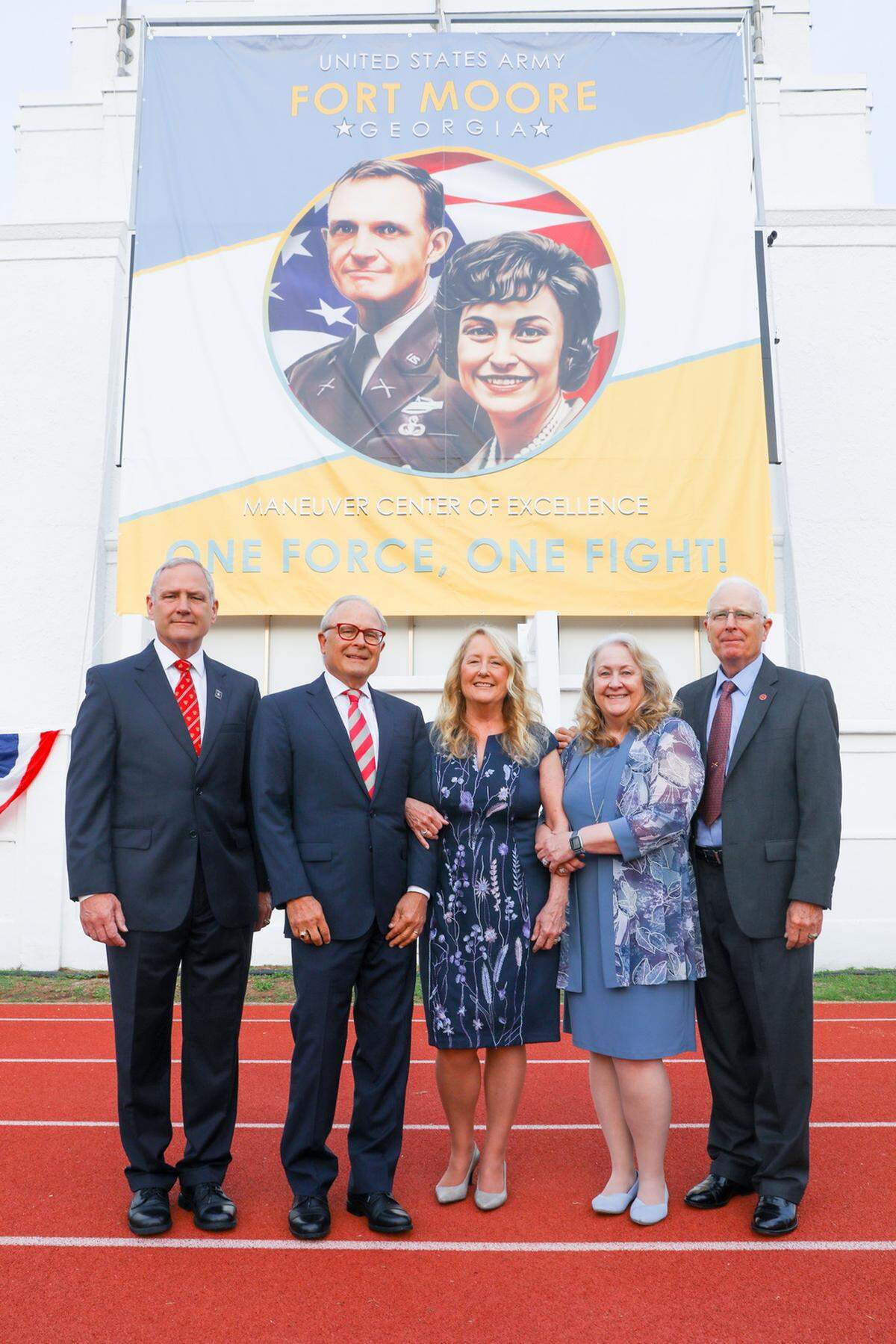 Hal and Julie Moore’s children, from left, Dave, Greg, Ceci, Julie, and Steve, on the day Fort Moore was renamed in honor of their parents.