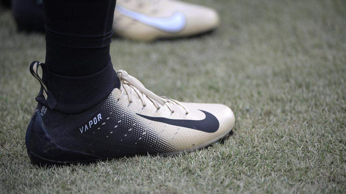 Central Florida players wear multi-colored Nike cleats while warming up before their game against South Carolina State last week in Orlando, Fla.