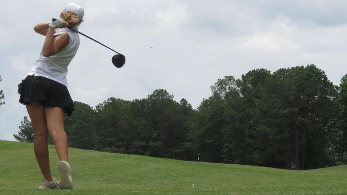 Columbus’ Maddy Krueger sends her tee shot flying down the fairway on the 17th hole at the Maple Ridge Golf Club in the first round of the Class 4A Girls Golf State Tournament on May 22, 2017.