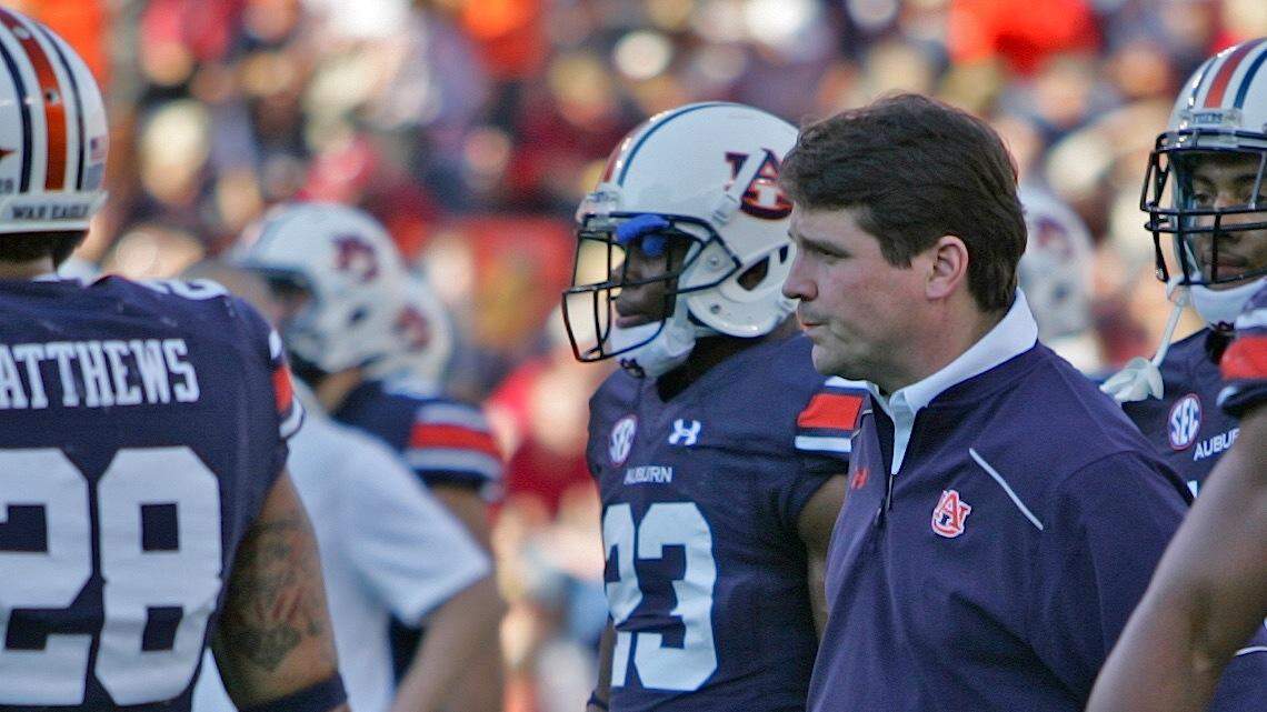 Auburn defensive coordinator Will Muschamp watches his team warm up on the sidelines before facing Alabama Saturday, Nov. 28, 2015. 
