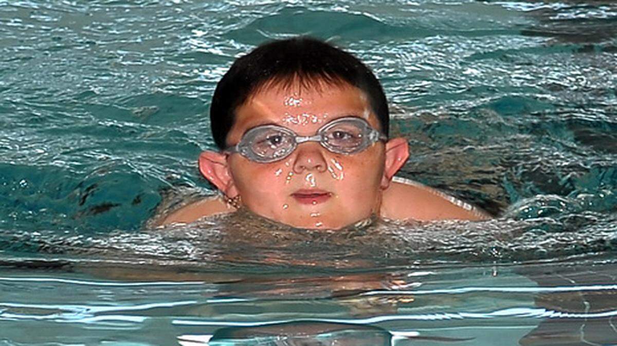 Sage Fitz swims laps at the John P. Thayer YMCA in downtown Columbus in April 2010.