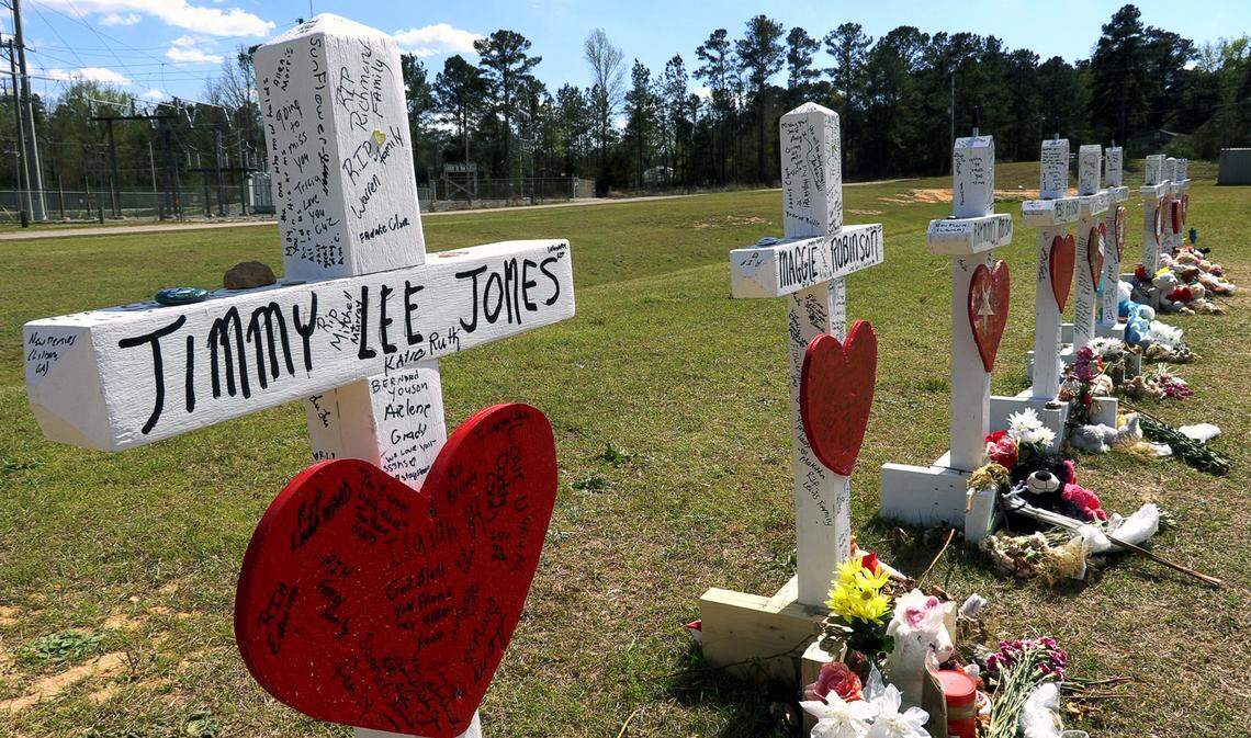 Crosses at Providence Baptist Church in the Beauregard community memorialize the victims of the devastating tornadoes that ripped through the area March 3, killing 23 people and causing devastating damage to homes and property across Lee County.