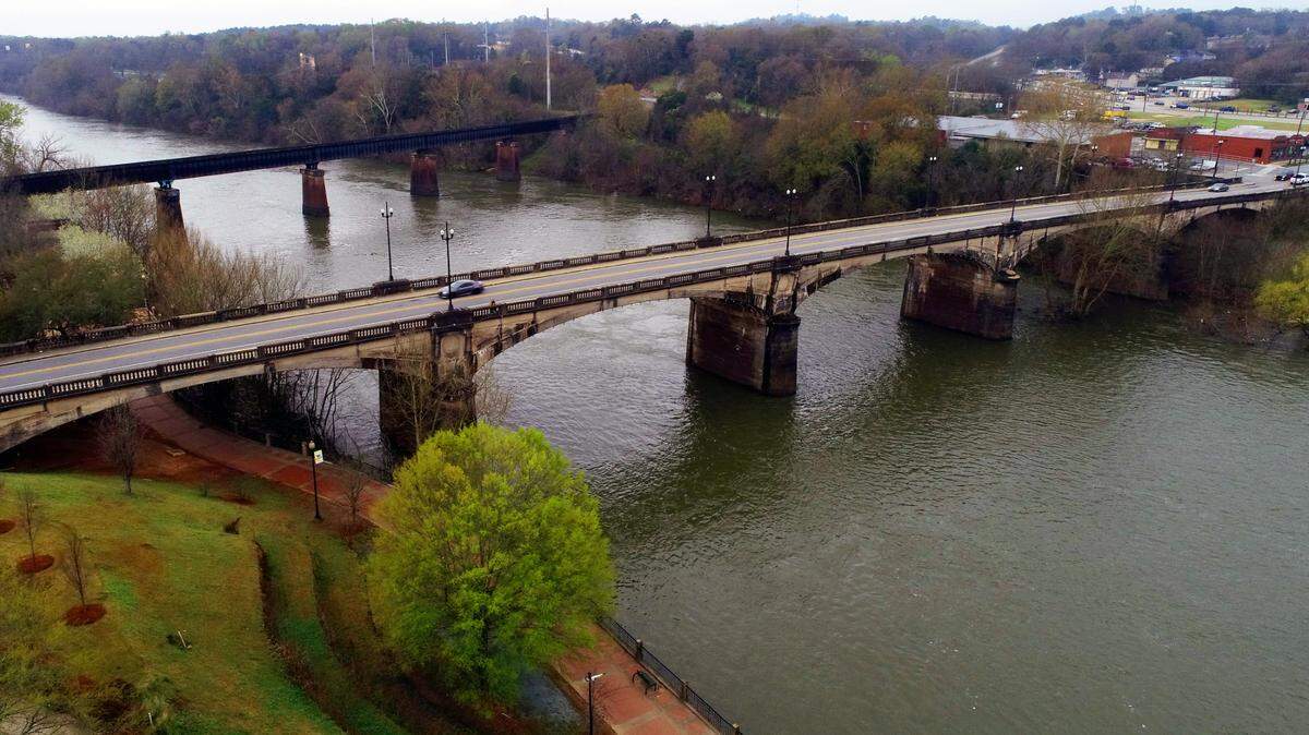 This view shows the Dillingham Street Bridge(foreground) that spans the Chattahoochee River, linking Columbus, Georgia with Phenix City, Alabama. 03/18/2022