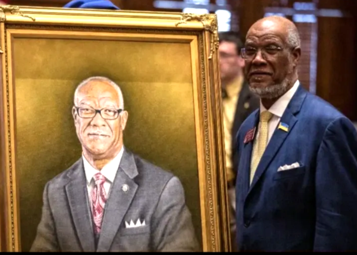 Retired state Rep. Calvin Smyre of Columbus poses next to his portrait before it was hung in the Georgia Capitol. Columbus artist Steven Tette painted the oil-on-canvas portrait.