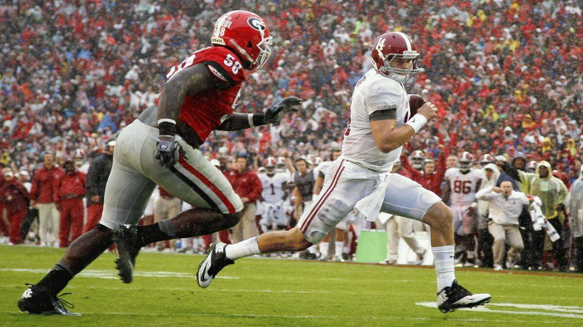 BRETT DAVIS/Associated PressAlabama quarterback Jake Coker out runs Georgia defensive tackle Sterling Bailey to score a touchdown in the second half Oct. 3 in Athens, Ga. Alabama won 38-10.