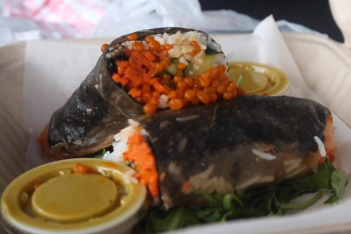 The Sushiritto — stuffed with carrot ginger caviar, purple cabbage, pickled veggies, coconut rice, and rolled in nori — is part of the ever-changing, chalkboard menu at Spankin Spoon.