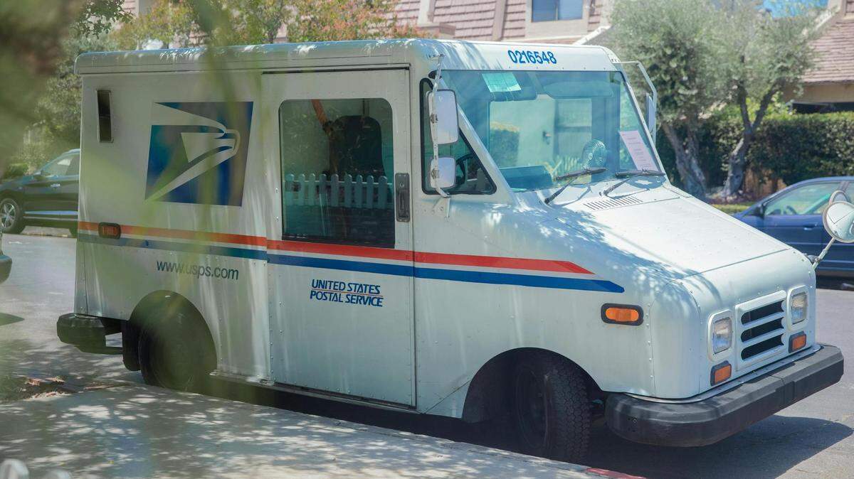 https://www.pexels.com/photo/postal-service-van-parked-on-a-street-sidewalk-4744769/