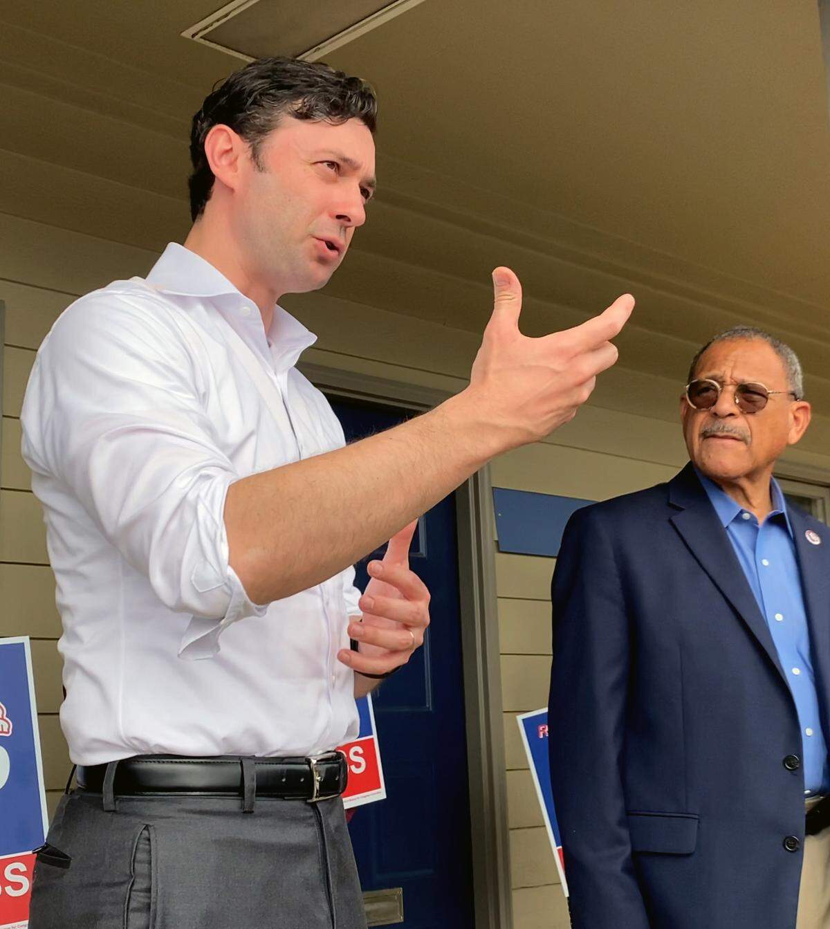 U.S. Sen. Jon Ossoff, center, campaigns for U.S. Rep. Sanford D. Bishop, right, in Columbus, Georgia on Saturday morning. 11/05/2022