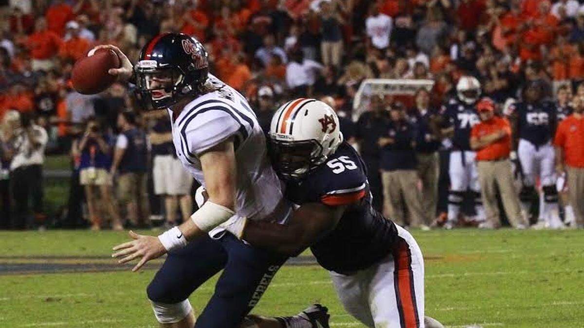 Auburn defensive end Carl Lawson sacks Ole Miss quarterback Bo Wallace last year in Jordan-Hare Stadium.