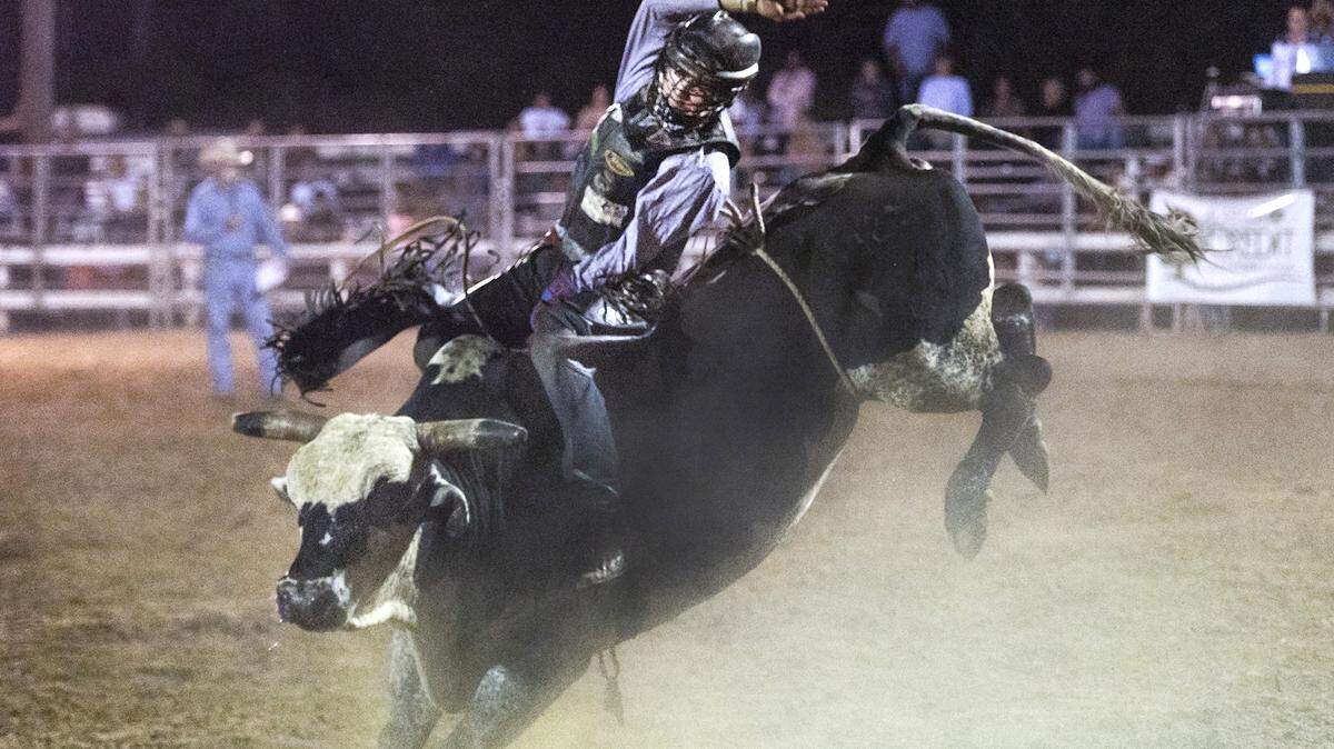 Josh Ethridge hangs on during a rough ride during the bull riding competition at the Russell County Stampede Rodeo on Oct, 13, 2019. Live rodeo events like this will be on display at J.R.’s Pro Rodeo in Denver this weekend.