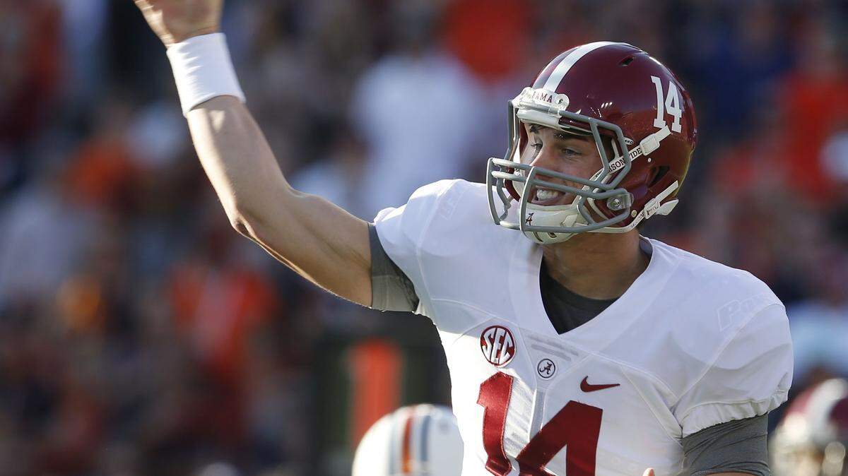 Alabama quarterback Jake Coker (14) passes the ball during an NCAA college football game, Saturday, Nov. 28, 2015, in Auburn, Ala. (AP Photo/Butch Dill)