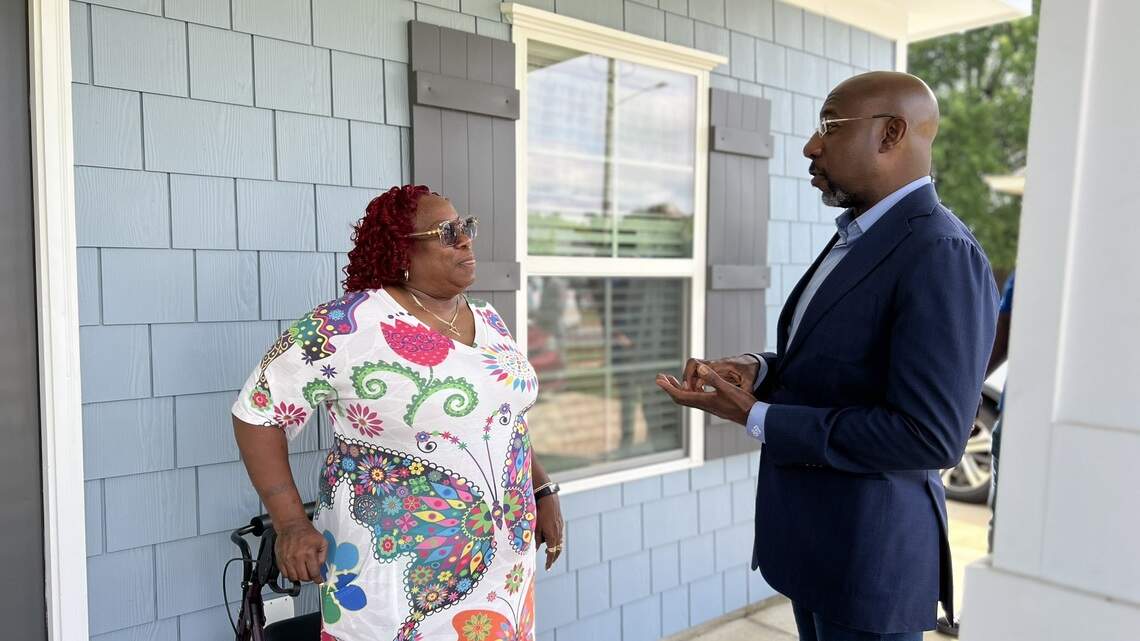 ‘Housing is dignity.’ Warnock tours example of what $4.3 million will help Columbus build