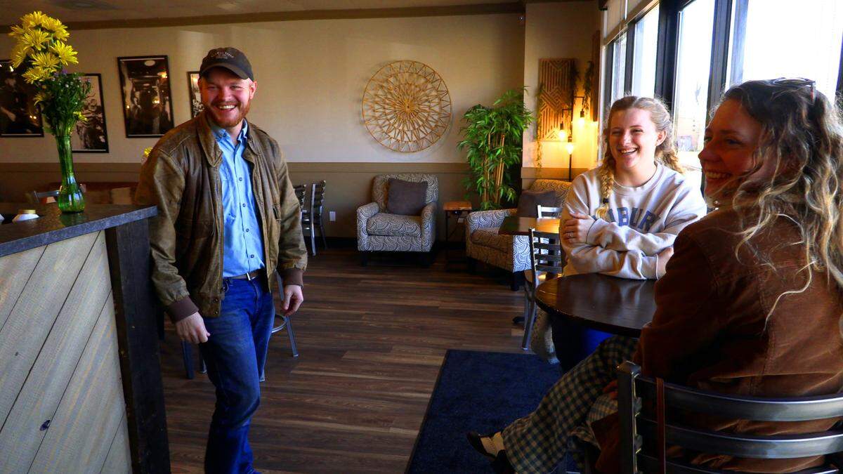 Andrew Cowart, Missional Network Pastor at Take the City, visits with customers at Harvest Coffee Co. in Columbus, Georgia. 12/06/2025