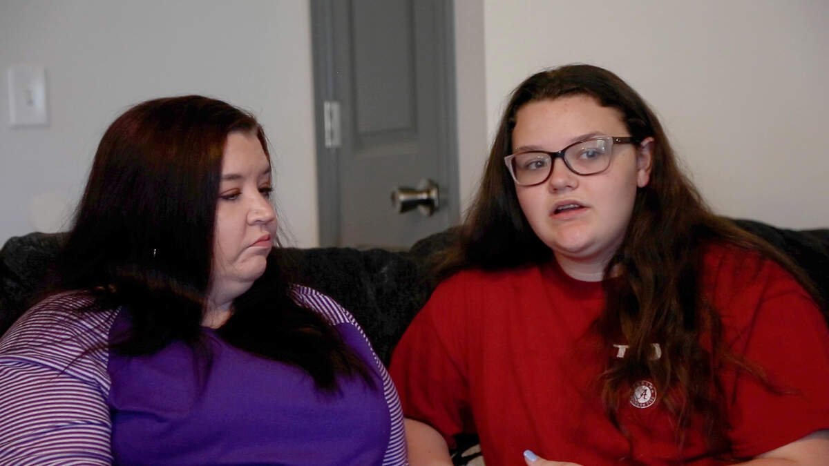 Leah Wiseman, with her mother Becky King, talks about the physical pain and social isolation when she had COVID-19, at their home in Phenix City, Ala., on August 25, 2021.