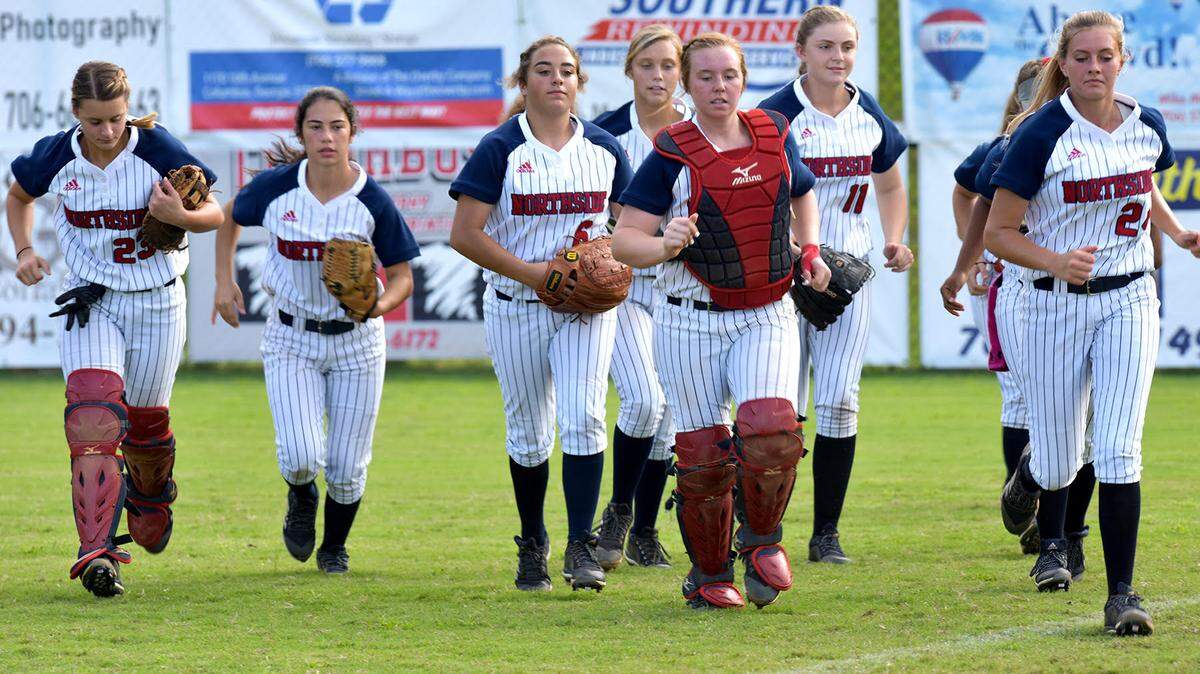 Northside softball players on the practice field before the start of the regional championship game against Cairo Thursday afternoon October 4, 2018 