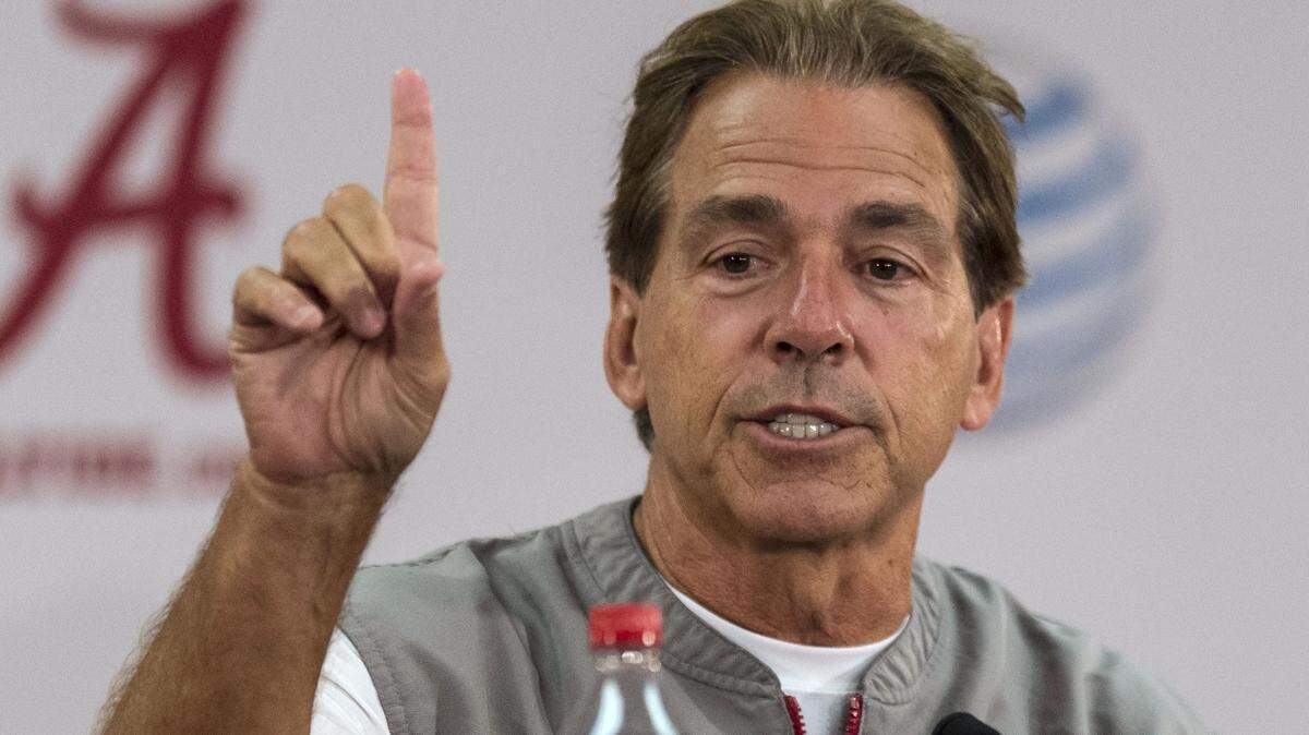 Alabama coach Nick Saban talks with reporters after NCAA college football practice Thursday, Aug 6, 2015, in Tuscaloosa, Ala. (Vasha Hunt/AL.com via AP)