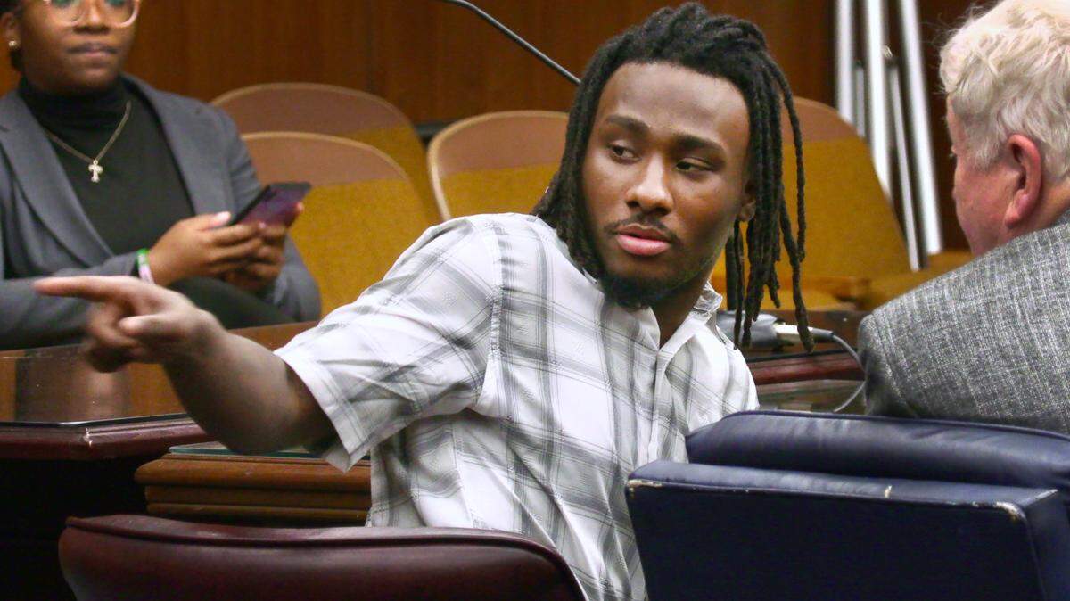 Lydell Maynard “Trapa” Sparks, center, motions to the back of the courtroom while waiting for court to resume Tuesday afternoon. 06/14/2022