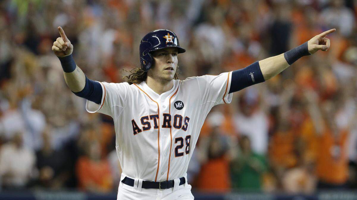 Houston Astros' Colby Rasmus (28) celebrates after hitting a solo home run against the Kansas City Royals in the seventh inning during Game 4 of baseball's American League Division Series, Monday, Oct. 12, 2015, in Houston. (AP Photo/Pat Sullivan)